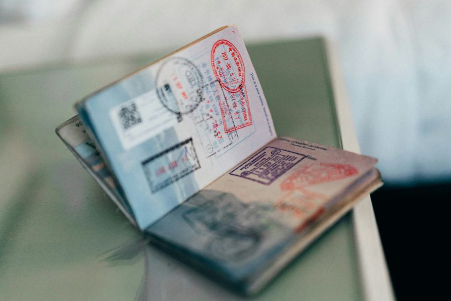 Consultant reviewing an existing passport for renewal